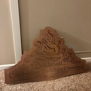 Decorative steel monastery sign with detailed cut work